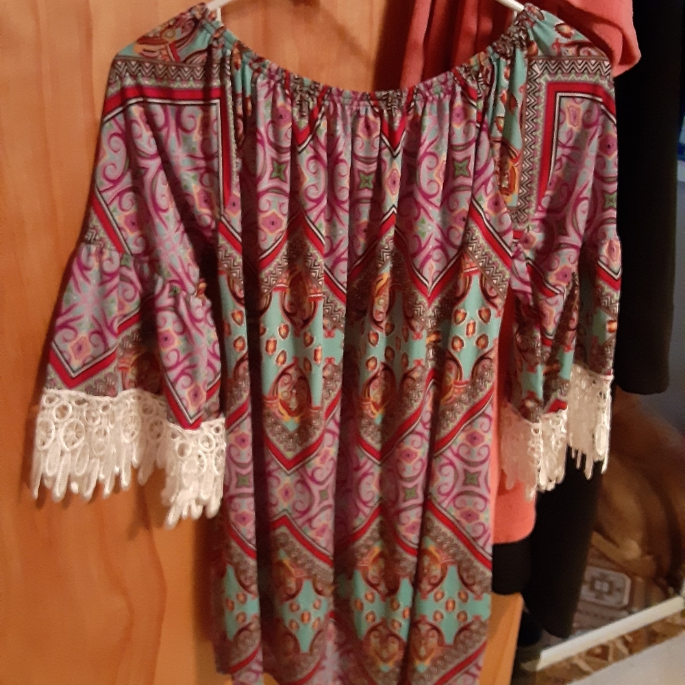 Bright colored dress with fringe sleeves